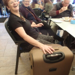 Ev with her suitcase, prior to departure